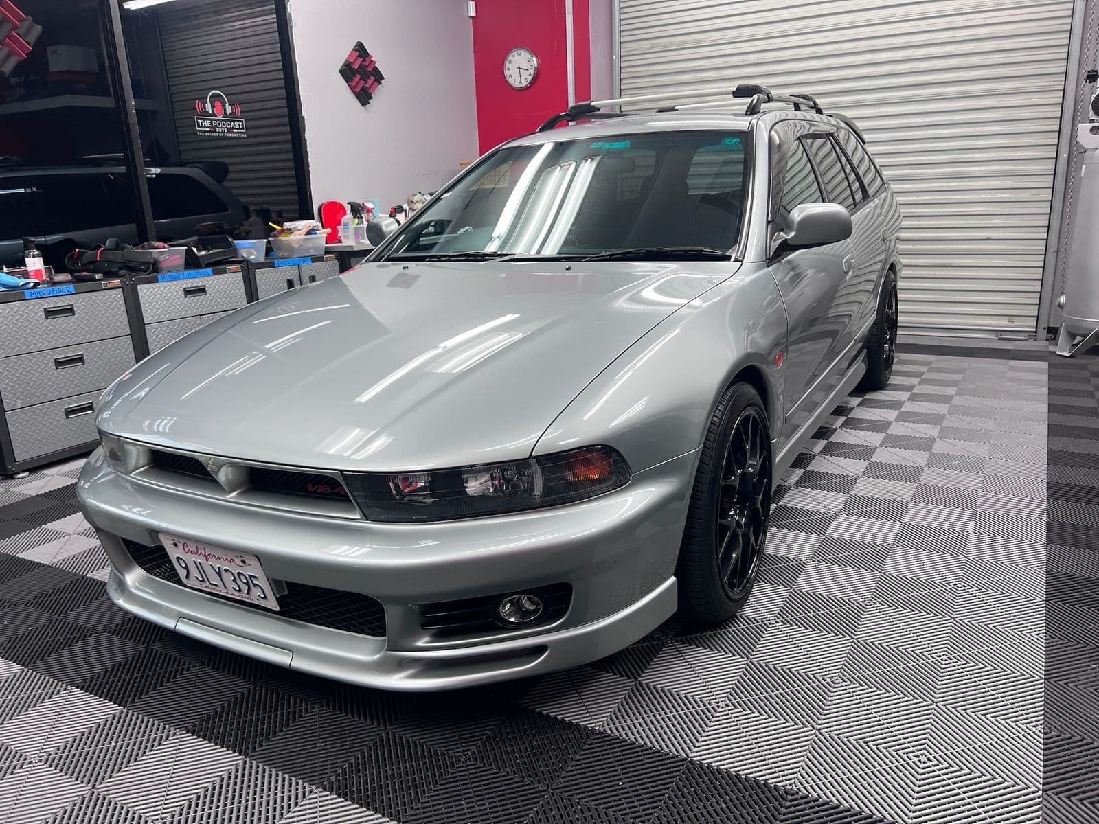 Silver sedan on the climate-controlled shop floor