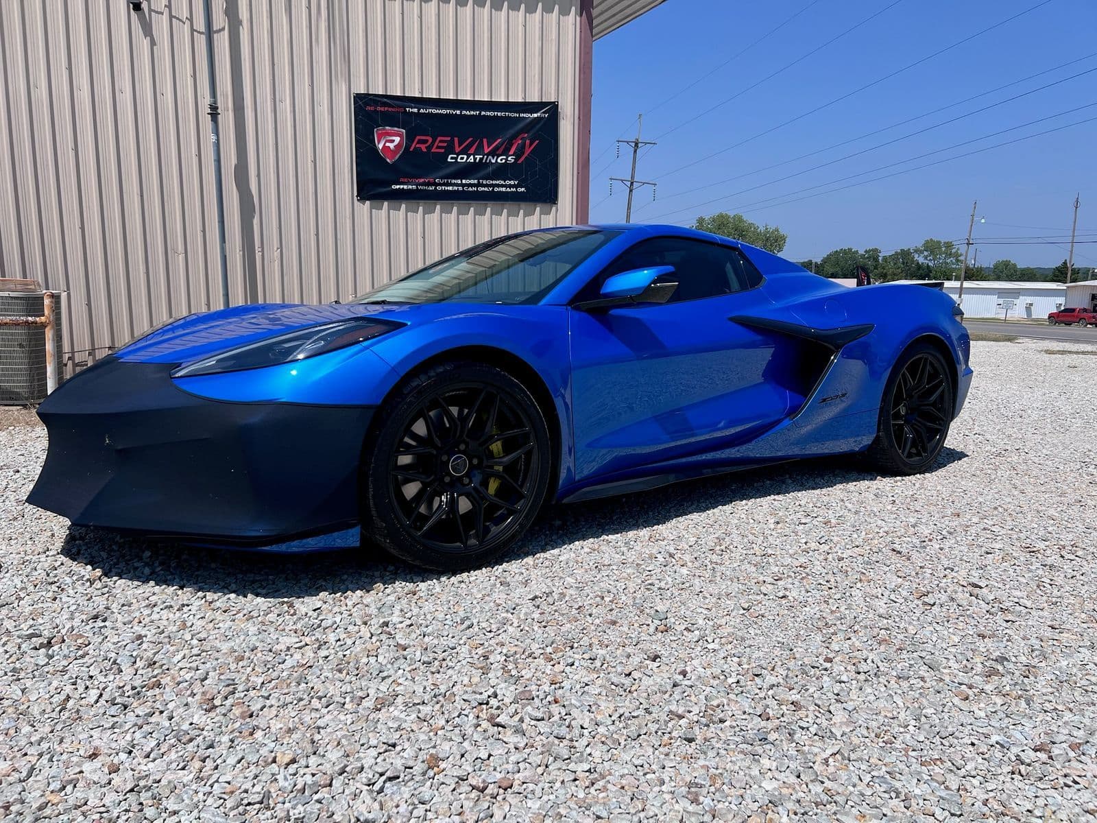 Blue Corvette outside the Grimeaway Autoworks shop