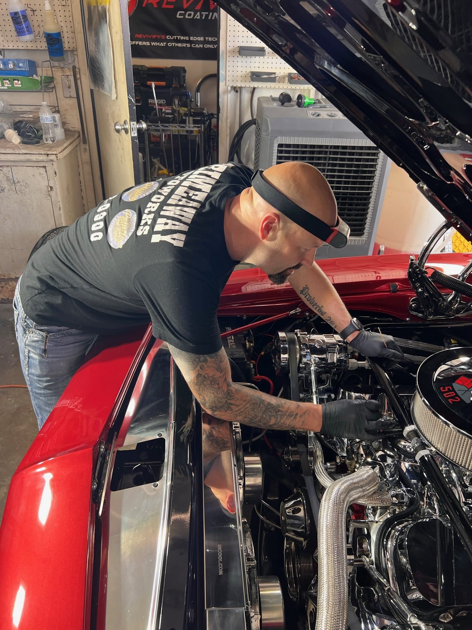 Destry Musgrove working on a vehicle