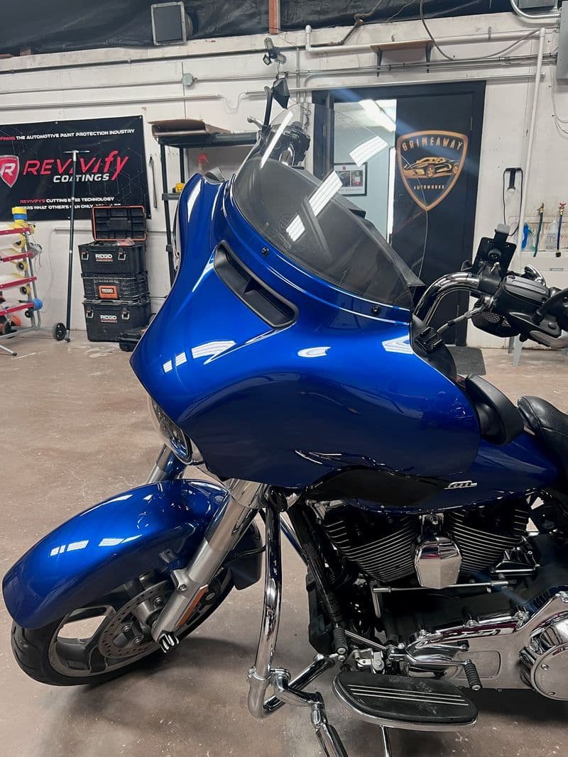 Blue Harley-Davidson touring motorcycle finished with a Revivify self-healing coating at Grimeaway Autoworks