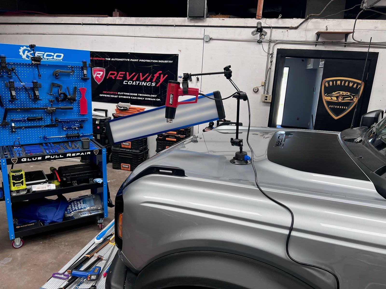 Paintless dent repair being performed at the Grimeaway shop