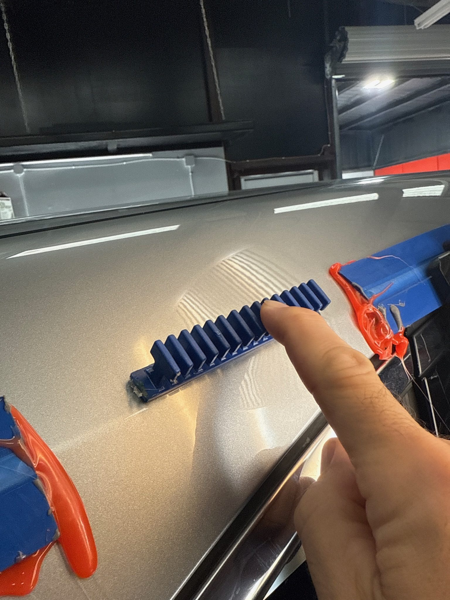 Paintless dent repair on a hail-damaged panel at Grimeaway Autoworks, serving Moore, OK